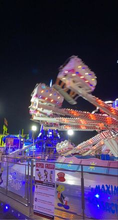 the carnival rides are lit up at night