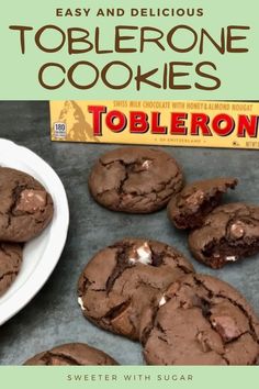 chocolate cookies with white crumbs are on a table next to a box of tollenoe cookies