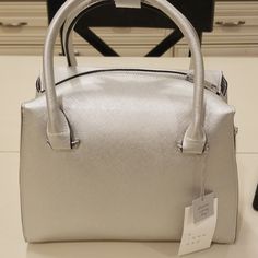 Silver Medium Size Bag. Elegant Satchel For Spring Errands, Elegant Silver Bag For Spring, Elegant Shoulder Bag For Spring Errands, Chic Silver Bag For Spring, Chic Silver Bags For Spring, Chic Satchel For Errands In Spring, Chic Satchel For Spring Errands, Classic Bags With Zipper Closure For Spring, Elegant Silver Bags