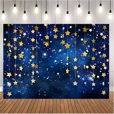 an image of stars in the night sky on a wall with wooden floor and lights