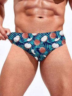 Escape to paradise with our Tropical Print Swim Brief. Embodying the spirit of a tropical getaway, this swim brief features a vibrant and exotic print that transports you to sun-soaked beaches and palm-fringed shores. Made from high-quality, quick-drying fabric, it offers a comfortable and flexible fit for all-day wear. Features: Pattern Type: Fruit & Vegetable Type: Briefs Fabric: Medium Stretch Material: Fabric Care Instructions: Hand wash or professionally dry clean Size Chart ( Inches ): Siz Tropical Style Swim Trunks With Tropical Print, Tropical Swim Trunks With Tropical Print, Surfing Swimwear Brief For Beach Season, Tropical Print Swim Trunks For Pool, Hawaiian Swimwear With Palm Tree Print, Tropical Surfing Swimwear For Vacation, Tropical Swimwear For Surfing Vacation, Tropical Swimwear For Surfing On Vacation, Multicolor Hawaiian Swimwear With Palm Tree Print