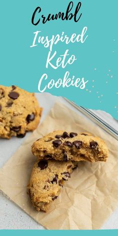 two chocolate chip cookies on top of parchment paper with the words crumbl inspired keto cookies