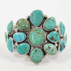 Sterling Silver Cuff Bracelet set with Clusters of Natural Turquoise Mountain Turquoise from Arizona. 2.25” Cuff Width5.125” Inside Measurement, plus 1” opening(6.125" Total Circumference - Small) Bola Tie, Tufa Casting, Flower Cuff Bracelet, Flower Cuff, Zuni Jewelry, Concho Belt, Navajo Jewelry, Turquoise Flowers, Native Jewelry