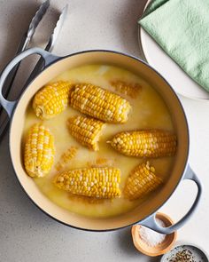 corn is cooked in a pot on the table