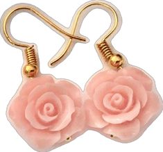 two pink flowers are attached to gold earwires with metal hooks on white background