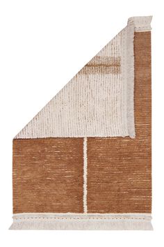 a brown and white area rug with an angled corner