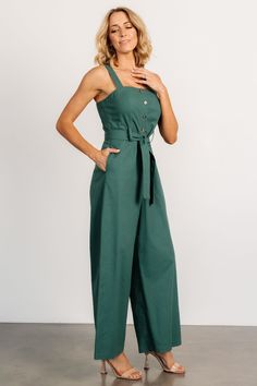 Baltic Born exclusive style Adorable jumpsuit for a day out on the town Deep Kelly green color Linen blend material has no stretch Straight neckline Functional buttons down bodice Tank sleeves Hidden pockets on both sides Removable self-tie belt at waist Wide-leg pant style Unlined Trina is 5'6, cup size 32D, size 2 and is wearing size S Fitted Green Overalls For Summer, Fitted Green Jumpsuit With Pockets, Fitted Green Overalls, Green Overall Jumpsuit For Day Out, Sleeveless Green Overalls, Green Sleeveless Overalls, Green Sleeveless Solid Color Overalls, Green Fitted Jumpsuits And Rompers For Work, Fitted Green Overalls For Spring