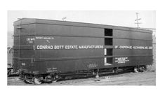 an old black and white photo of a train car