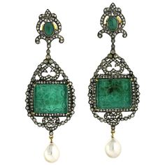 These hand carved earrings are meticulously crafted in 18-karat gold and sterling silver. It is set in 49.65 carats Emerald, 12.9 carats pearl and 3.91 carats of glimmering diamonds. FOLLOW MEGHNA JEWELS storefront to view the latest collection & exclusive pieces. Meghna Jewels is proudly rated as a Top Seller on 1stDibs with 5 star customer reviews. All items manufactured by us are handmade and can be customized or redesigned. Composition Size-82X28 MM Total Weight-34.142 Gold Weight(Gms)-1.81 Carved Emerald, Gold Silver Jewelry, Pearl And Diamond Earrings, Pearl Earrings Dangle, Mens Jewelry Bracelet, Lovely Jewellery, Gold Earrings Dangle, Heart Jewelry, 925 Sterling Silver Jewelry