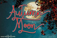 the words autumn moon are lit up in front of a full moon