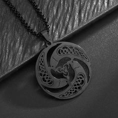 Celebrate the rich heritage of Celtic spirituality and Wiccan beliefs with our stunning Trinity Celtic Knot Necklace. Crafted from high-quality stainless steel, this captivating pendant features the iconic triquetra - a sacred trinity knot representing the interconnectedness of mind, body, and spirit. The triquetra design is a powerful symbol deeply rooted in Irish and pagan traditions, representing the triad of the maiden, mother, and crone, as well as the three realms of land, sea, and sky. Th Triquetra Jewelry, Norse Pagan Jewelry, Nickel-free Black Spiritual Necklaces, Sacred Spiral, Wicca Necklace, Triquetra Pendant, Wicca Jewelry, Pagan Pendants, Magical Accessories