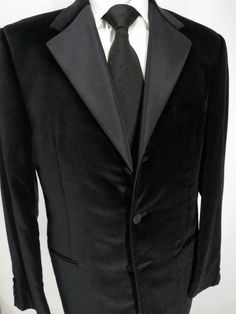 a black suit and tie on a mannequin