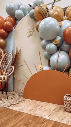 a room with balloons and chairs in it