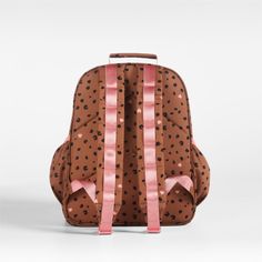 A backpack that's extra comfy and ready to handle a day in the wild. Patterned with cheetah spots and light pink hearts on a tawny brown background, the kids' medium knapsack is constructed of supremely durable polyester made from recycled water bottles. A roomy interior holds everything your kid needs-books, school supplies, extra layers-and there's a padded pocket to keep their tablet protected. Outside pockets hold snacks, water bottles and more. For an adventurous combination, pair this book Cute Brown Backpack For Back To School, Cute Brown Backpack For School, Cute Brown School Backpack, Cute Brown Travel Backpack, Playful Brown School Bag, Cheetah Spots, Books School, Tawny Brown, Bottle Picture