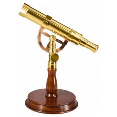 a brass telescope on a wooden stand with a magnifying glass in the center