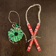 two pieces of fabric and twine tied to each other on top of a wooden table