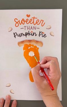 someone is painting a piece of paper with the words sweeter than pumpkin pie on it