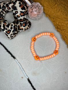 Creamsicle themed bracelet. clay beaded bracelet perfect for summer. these are bracelets that I make by hand. Fun Beaded Heishi Beads Bracelets, Trendy Plastic Beaded Bracelets For Beach, Cute Plastic Bracelets With Letter Beads, Trendy Handmade Plastic Bracelets, Handmade Fun Beaded Plastic Bracelets, Plastic Beaded Friendship Bracelets, Handmade Fun Plastic Beaded Bracelets, Handmade Novelty Plastic Beaded Bracelets, Handmade Plastic Novelty Beaded Bracelets