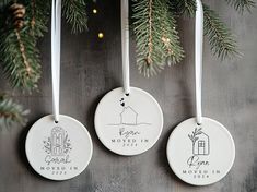 three ceramic ornaments hanging from a christmas tree