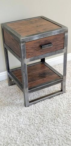 a wooden and metal end table on carpeted floor