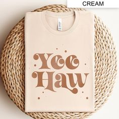 Embrace the classic cowboy spirit with our "Yee Haw" Western Cowboy Shirt. Perfect for country music lovers and southern style enthusiasts, this vintage-inspired tee features a rustic "Yee Haw" graphic, blending modern design with retro charm. Ideal for rodeo events, concerts, or casual outings, this shirt brings a touch of the wild west to your everyday wardrobe. Show off your love for country western themes with this unique and stylish t-shirt. Boy Western, Cowboy Graphic, Retro Cowboy, Rodeo Events, Classic Cowboy, Rodeo Shirts, Cowboy Shirt, Far West, Yee Haw