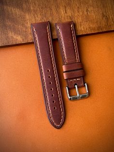 -Grazy Horse Brown color genuine leather(optional) -Light Brown color stitches -22/20 mm width(optional) -Lenght:125x75mm Made to order product... Classic Leather Watch Strap, Classic Brown Watch With Wrist Strap, Classic Brown Vegetable Tanned Leather Watch Band, Brown Leather Rectangular Watch Bands, Rectangular Brown Leather Watch Bands, Horse Brown, Leather Watch Strap, Pen Case, Luxury Watch