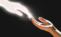 two hands reaching out towards each other with light coming from their fingertipss royalty images