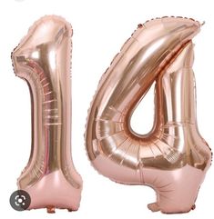 the number four balloon is pink in color