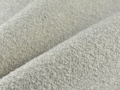 a close up view of a white fabric textured with light gray color and very soft