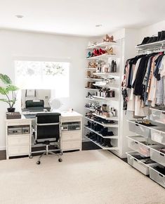 an organized closet with clothes, shoes and other items on shelves in front of a window