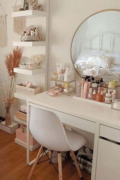 a white desk topped with a mirror and lots of clutter