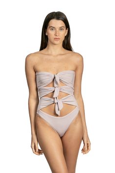 Santa Cruz by Sanlier is a one-piece that features multiple ties in the front for a playful, unique look. Plus, the strapless design adds an alluring element to this otherwise innocent piece. It’s equally subtle and sexy while offering plenty of support. Chic Bandeau Swimwear, Elegant Strapless Swimwear For Evening, Elegant Strapless Evening Swimwear, Chic Strapless Tube Top For Poolside, Elegant Bandeau Party Swimwear, Elegant Strapless Swimwear For Party, Chic Strapless Swimwear For Evening, Elegant Strapless Swimwear For Spring, Chic Strapless Party Swimwear