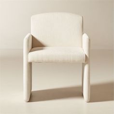 a white chair sitting on top of a floor