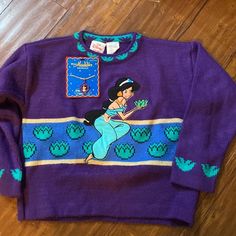 Vintage The Disney Store Princess Jasmine From Aladdin Sweater Sweater Material With Appliqu Of Jasmine Embroidered On Front And Sleeve Detail! Excellent Gently Used Condition With Very Mild Piling. Vibrant Purple Color. A Great Rare Find! Also A Razzazzles Aladdin Jasmine Necklace By Applause To Wear With It! Complete This 90s Look With Another Original! New In Package Condition Collectible! Jasmine Necklace, Jasmine From Aladdin, Mickey Mouse Jacket, Minnie Mouse Sweater, Aladdin Jasmine, Baby Robes, Disney With A Toddler, Disney Toddler, 90s Looks