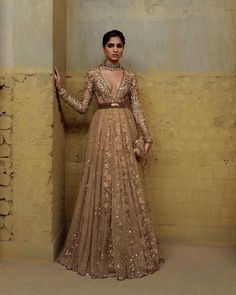 Whether you're attending a glamorous event or a formal celebration, this Sabyasachi inspired gown promises to make a lasting impression. Embrace the allure of the sequin-studded bodice, the richness of metallic zari thread aari work, and the sheer beauty of net fabric, all seamlessly combined to create a gown that transcends trends and stands as a timeless symbol of elegance. Elevate your wardrobe with this enchanting piece that effortlessly blends modern sophistication with traditional craftsma Sabyasachi Gown, Sabyasachi Bridal, Sangeet Outfit, Reception Outfit, Reception Gown, Cocktail Outfit, Indian Dresses Traditional, Traditional Indian Outfits, Indian Gowns