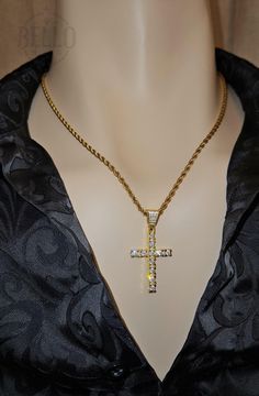 Embrace your faith with our Sparkling Cross Pendant Necklace. This elegant pendant features a beautifully crafted cross adorned with sparkling stones, symbolizing hope and devotion. Pendant Material: 925 Sterling Silver Gold Finish Chain Material: Stainless Steel Design: Detailed cross with sparkling stones Features: Hypoallergenic, suitable for sensitive skin Perfect For: Daily wear, religious events, special occasions, or as a thoughtful gift This Sparkling Cross Pendant Necklace is a timeless Spiritual Diamond-cut Cross Jewelry, Spiritual Cross Jewelry With Diamond Cut, Spiritual Diamond Cut Cross Jewelry, Vvs Clarity Crucifix Jewelry Gift, Gold Bling Cross Pendant Necklace, Gold Cross Pendant Necklace With Bling, Vvs Clarity Crucifix Necklace As Gift, Gold Bling Cross Necklace, Cubic Zirconia Cross Jewelry With Adjustable Chain