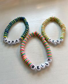 three bracelets with words written on them