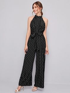 This incredible belted, cut-out, button, pleated, and zipper sleeveless halter Belted Polka Dot Halter Neck Jumpsuit is the perfect addition to any wardrobe. Made from a non-stretch fabric, this dress features a high waistline that cinches the waist and accentuates any figure. The unique cut-out design and pleated detailing along the front and back of the dress add a special touch of elegance. Specifications: Details: Belted, Cut Out, Button, Pleated, Zipper Sleeve Length: Sleeveless Neckline: Halter Fabric: Non-Stretch Waist Line: High Waist Fit Type: Regular Fit Composition: 90% Polyester, 6% Viscose, 4% Elastane Care Instructions: Machine wash or professional dry clean Product Measurements(cm): Size US Belt Length Bust Hip Size Length Thigh Waist Size XS 2 200 84 103 143.4 67.3 67 S 4 2 Halter Neck Jumpsuit, Halter Jumpsuit, Cut Out Design, Halter Neck, Stretch Fabric, Polka Dot, The Dress, Cut Out, Polka Dots