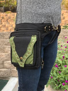 Looking for a purse? Looking for a fanny pack? Well, THIS bag can be both! :) ➼ Can be worn as an efficient fanny pack OR a crossbody bag! ➼ Gorgeous gold studs! ➼ For jogging, running, hiking, dog walking, shopping, running errands, and more! ➼ Leg Belt for extra security! ➼ Adjustable Belt Length (Waist/Hip/Shoulder): 36 inches - 56 inches ➼ Adjustable Leg Belt (removable, too 13 inches - 22 inches ➼ Pack Dimensions: 10 inches X 8 inches ➼ FOUR TOTAL COMPARTMENTS! - Compartment on Front (close Pouch Belt Bag With Pockets For School, Everyday Backpack Belt Bag With Pockets, School Belt Bag Pouch With Pockets, School Pouch Belt Bag With Pockets, School Belt Bag With Pockets And Pouch Shape, Green Belt Bag With Removable Pouch For Outdoor Activities, Black Belt Bag With Pockets For School, Black Pouch Belt Bag For Outdoor Activities, Outdoor Shoulder Belt Bag With Cell Phone Pocket