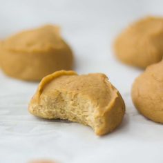 some peanut butter cookies are on a white surface