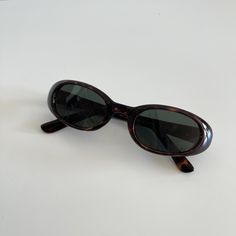 These round oval sunglasses are your everyday classic. Featuring a brown tortoise frame with smoke lens. This style is unisex. True genuine vintage sunglasses from the 90s.  - 400 uv  - new vintage from the 90s - includes sunglasses pouch  Measurements: Lens height 28mm Lens width 45mm Bridge 17mm Arm temple 140mm Also available in black https://etsy.me/3lQoQDM Sunglasses 90s, Tomboy Femme, Throwing Fits, 90s Sunglasses, Italian Sunglasses, Sunglasses Pouch, 90s 00s, Vintage Sunglasses, Oval Sunglasses