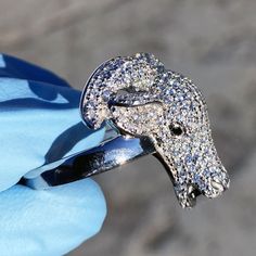 Mens real solid 925 sterling silver Goat ring. Available in mens size 7, 8, 9, 10, 11, 12, 13. Ring stamped on the inside of the band "925". Nicely iced with white cz micro pave gems. Goat holds a dazzling black stone in mouth. These solid pieces weigh 10 to 12 grams each. Goat head measures approx. 1" inch x 1" inch. Genuine 925 sterling silver, not cheap metal. Real jewelry that won't turn your fingers green. Bright silver rings that are jewelry masterpieces. Choose ring from pinky size 7 and Goat Ring, Goat Head, Head Ring, Real Jewelry, Hip Hop Jewelry, Bling Rings, Black Stone, Micro Pave, Solid 925 Sterling Silver