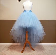 "I CAN MAKE THIS TUTU IN ANY COLOR AND SIZE, PLEASE NOTE THE EXACT TULLE AND RIBBON COLOR AT CHECK OUT (Without note I will make it same color with 1st list photo). 1ST PHOTO TUTU LENGTH FRONT 16'' ABOVE THE KNEE LENGTH, BACK 48'' FLOOR LENGTH, FOR HEIGHT AROUND 5'7'' wear a couple inches of heels . This tutu is made with 250-500 yards of 6'' wide fine tulle so it's super full. Stretchy waist along with a big ribbon bow ties on the waist. (I might use 2''or 1.5'' ribbon depends on which one is in stock.) Sew in lining, the tulle will stay nice and not see through. List photo black tutu front is 16'' above the knee length, back is 44'' full length. Layered cut. The rest photos are fairy angled cut. You will love your tutu once you put it on! TAKING MEASUREMENTS: WAIST: measure your waist wh Fitted Blue Tutu Dress For Wedding, Fitted Tulle Tutu Dress For Bridesmaids, Fitted Tulle Tutu Bridesmaid Dress, Fitted Light Blue Tutu Dress For Wedding, Light Blue Fitted Tutu Dress For Wedding, Fitted Tutu Dress For Bridesmaids In Prom Season, Fitted Tulle Tutu Dress For Prom, Fitted Tulle Tutu Dress For Wedding, Wedding Tutu Dress With Fitted Tulle