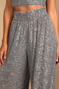 No other styles can even compete with the shine the Lulus Flawless Sparkle Silver Sequin Wide-Leg Pants is giving off! These high-waisted pants have a stretchy elastic waistband and wide pant legs (with side seam pockets), all covered in shimmery sequins. Pair with the matching tank top for a complete look! Fit: This garment fits true to size. Length: Floor length. Size medium measures 44.5" from waist to hem. Inseam: 31.50 Front Rise: 13.00 Waist: Fitted - elastic waist allows stretch. Hip: Loo Silver Sequined Wide Leg Bottoms, Holiday Wide-leg Sequined Bottoms, Elegant Wide-leg Sequin Bottoms, Holiday Sequined Wide-leg Bottoms, Holiday Sequin Wide-leg Bottoms, Sequin Pants, Silver Sequin, Wide Pants, High Waisted Pants