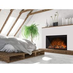 a bedroom with a bed and fireplace in it