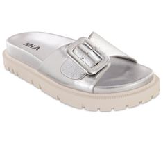 Elevate your summer style with the MIA Shoes Slip-On Sandals - Gya. Designed for the modern woman, these sandals feature a trendy single-buckle strap and a signature contoured footbed for unparalleled comfort. Perfect for any warm-weather outing, Gya promises to be your go-to footwear this season. From MIA Shoes. Silver Round Toe Slides With Buckle Closure, Silver Open Toe Slides With Buckle Closure, Silver Open Toe Slides With Buckle, Silver Footbed Sandals For Summer, Silver Footbed Sandals With Round Toe For Summer, Modern Beach Slides With Buckle Closure, Silver Open Toe Footbed Sandals With Buckle Closure, Modern Slides With Buckle Closure For Beach, Trendy Silver Sandals With Buckle Closure