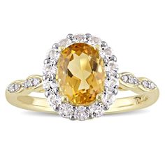 This lovely Miadora engagement ring is set in 14-karat yellow gold and features an oval-shaped citrine stone at its center with a halo of white topaz and diamond accents surrounding it. This ring is sure to add a touch of colour and elegance to any ensemble.Center stone Gemstone: Citrine Number of gemstones: One Gemsto Architectural Jewelry, Enchanted Disney Fine Jewelry, Engagement Ring Size, Gold Gemstone Ring, Hot Jewelry, Citrine Stone, Crystal Stud Earrings, Geometric Jewelry, Pretty Rings