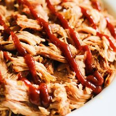 shredded pork with bbq sauce in a white bowl