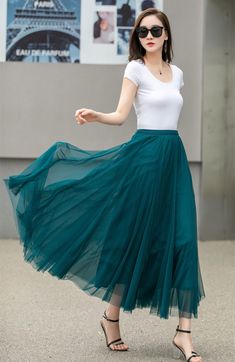 "This blue tulle swing skirt is perfect for any occasion! The lightweight fabric flows beautifully, and the pleated design adds a playful touch. Whether you dress it up for a night out or keep it casual with sandals, this skirt is sure to become a go-to in your wardrobe. DETAILS: * Tulle Skirt * No Pockets * Around elastic waistband * Circle Skirt * Big swing skirt * Perfect for spring, summer * Suit vacation, beach, dance etc. * Machine Washable in Warm/Cold Water; Do not bleach / Mid-iron / Hang Dry *The model is 170 cm (5′7″) tall with a 80 cm (31.5\") bust, 66 cm (26\") waist. She is wearing the skirt in size XS. * Choose CUSTOM Order if you Can't find your size in our size Chart Chang the Length Your Height is not Between 5'1\" - 5\"9\" Your weight is not Between 47 kg - 75 kg SIZE GU Tulle Midi Skirt, Skirt Summer, Blue Tulle, Wool Clothing, Dance Skirt, Blue Beach, Skirt Long, Summer Suits, Skirt Women