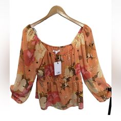 This Beautiful Blouse By Dr2, Designed By Daniel Rainn, Features A Colorful Floral Pattern Perfect For Any Occasion. With 3/4 Cold Shoulder Sleeves And A Semi-Sheer Polyester Material, This Blouse Is Perfect For Both Summer And Spring And Can Be Dressed Up For Parties Or Dressed Down For Casual Wear. The Size L Blouse Is Ideal For Women And The Multicolor Design Is Sure To Complement Any Style. The Top Is Brand New With Tags And Has Never Been Worn. This Blouse Is A Must-Have For Any Fashion-For Multicolor Print Long Sleeve Tops For Vacation, Flowy Multicolor Tops For Fall, Flowy Multicolor Floral Print Tops, Fitted Multicolor Print Summer Blouse, Printed Long Sleeve Summer Blouse, Long Sleeve Floral Print Summer Blouse, Fitted Multicolor Print Blouse For Summer, Spring Multicolor Printed Blouse, Flowy Multicolor Floral Print Blouse